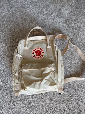 Fjallraven Kanken Mini Backpack in Beige with Red Logo